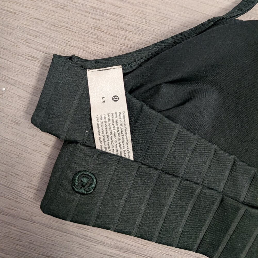 Lululemon ribbed halter swim top with a cross back in forest green - size large.